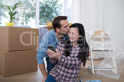 Man kissing to pregnant woman