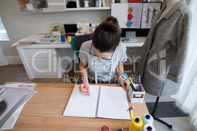 Fashion designer working at desk
