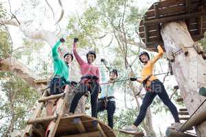 Friends having fun in adventure park