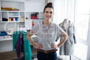 Fashion designer standing with hands on hip