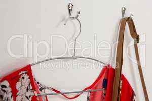 Dress and bag hanging on hook