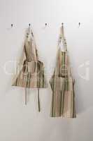Aprons hanging on hook
