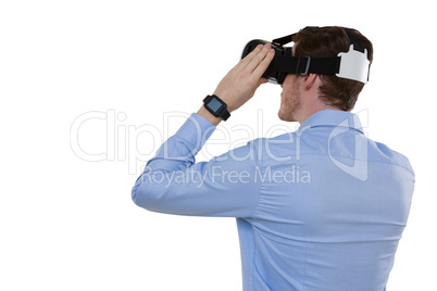 Male executive using virtual reality headset