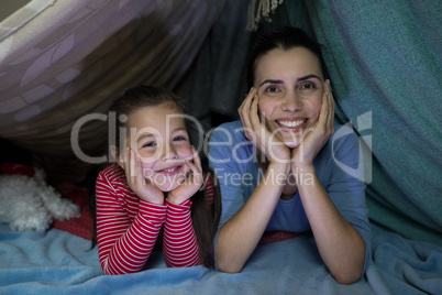 Mother and daughter playing at home