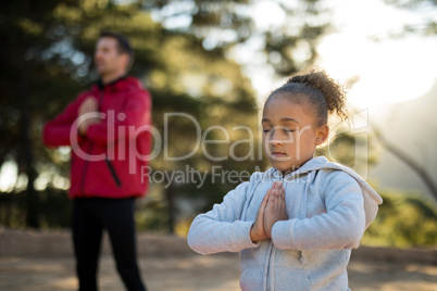 Close-up of girl meditating in park