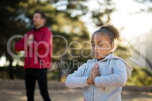 Close-up of girl meditating in park