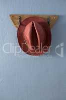 Straw hat hanging on hook