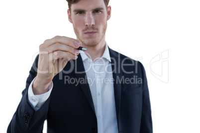 Businessman writing on an invisible screen