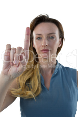 Female executive pretending to use an invisible screen