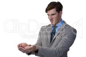 Businessman pretending to hold an invisible object