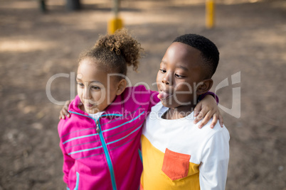 Kids standing with arms around