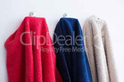 Colorful towels hanging on hook