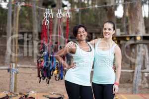 Fit women standing together in parkland