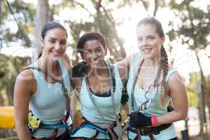 Fit women standing together in parkland