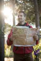 Man holding map in forest