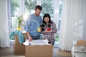 Couple looking at the blueprint of their new home