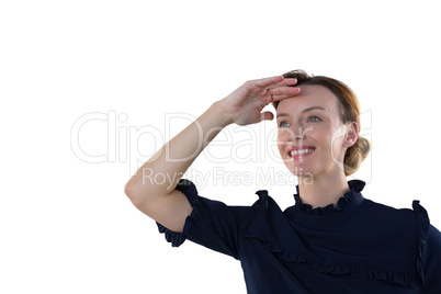 Female executive shielding eyes against white background