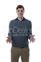 Male executive gesturing against white background