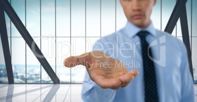 Businessman with hand palm open in city office