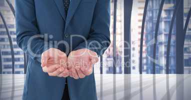 Businessman with hands palm open in city office