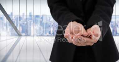 Businessman with hands palm open in city office