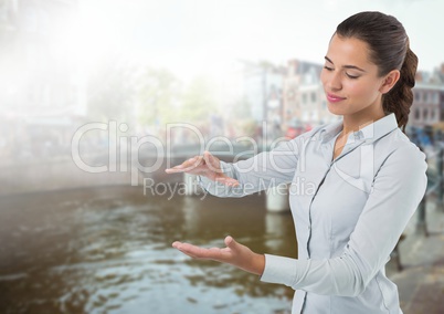 Businesswoman with hands palm open in city