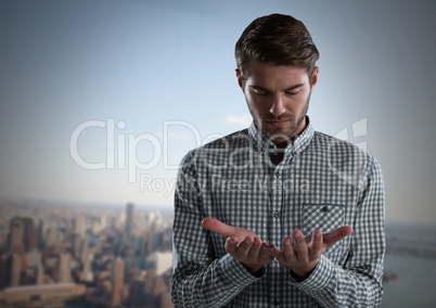 Businessman with hands palm open in city