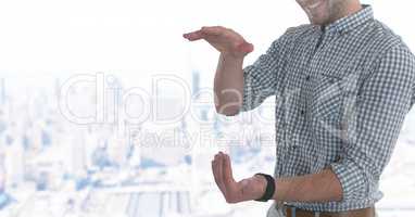 Businessman with hands palm open in city