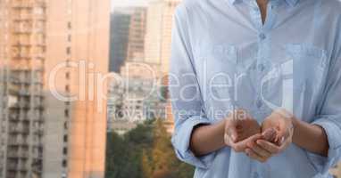 Businesswoman with hands palm open in city