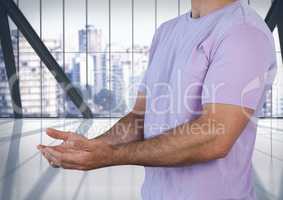 man with hands palm open in city office