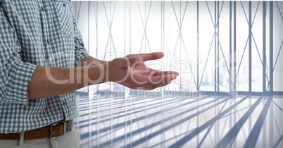 Businessman with hands palm open in city office