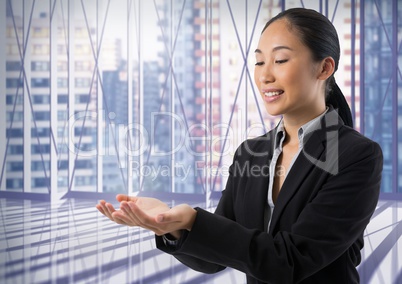 Businesswoman with hands palm open in city office