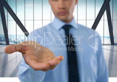 Businessman with hand palm open in city office