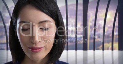 Businesswoman with eyes closed in city office