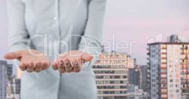 Business person with hands palm open in city