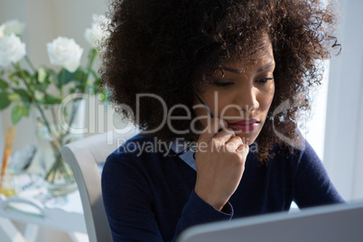 Close-up of beautiful woman working on desktop pc