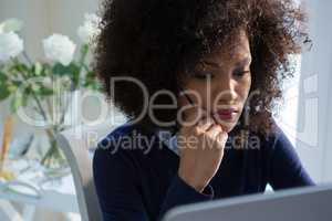 Close-up of beautiful woman working on desktop pc