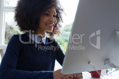 Beautiful woman working on desktop pc