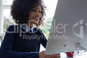 Beautiful woman working on desktop pc