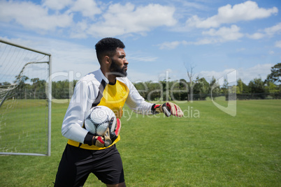 Goalkeeper ready to throw soccer ball