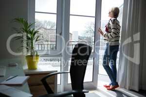 Woman standing at home