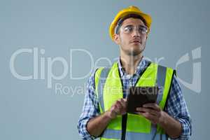 Male architect using digital tablet