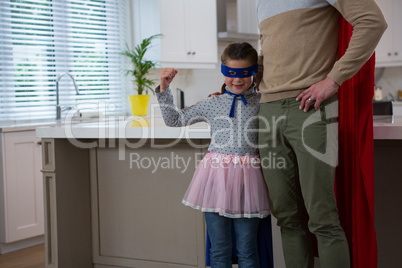 Father and daughter pretending to be superhero