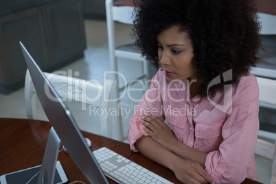 Woman using computer at home