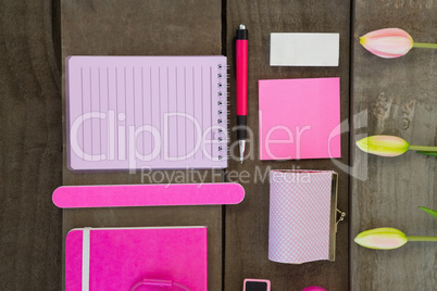 Overhead of female accessories and stationery