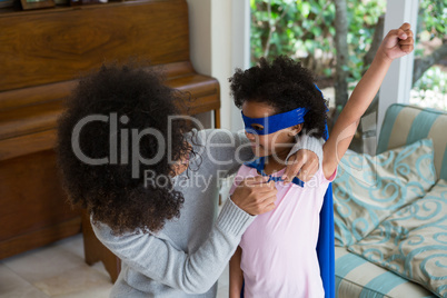 Mother and daughter pretending to be superhero