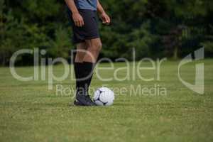 Football player ready to kick the soccer ball