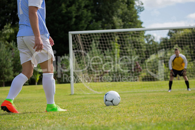 Soccer player is ready to kick ball from penalty spot