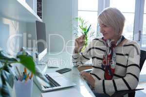 Happy woman using laptop