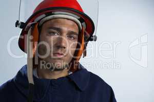 Fireman looking at camera against white background